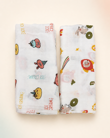 Maison Joey muslin swaddles pack of two on a seamless warm ivory studio background