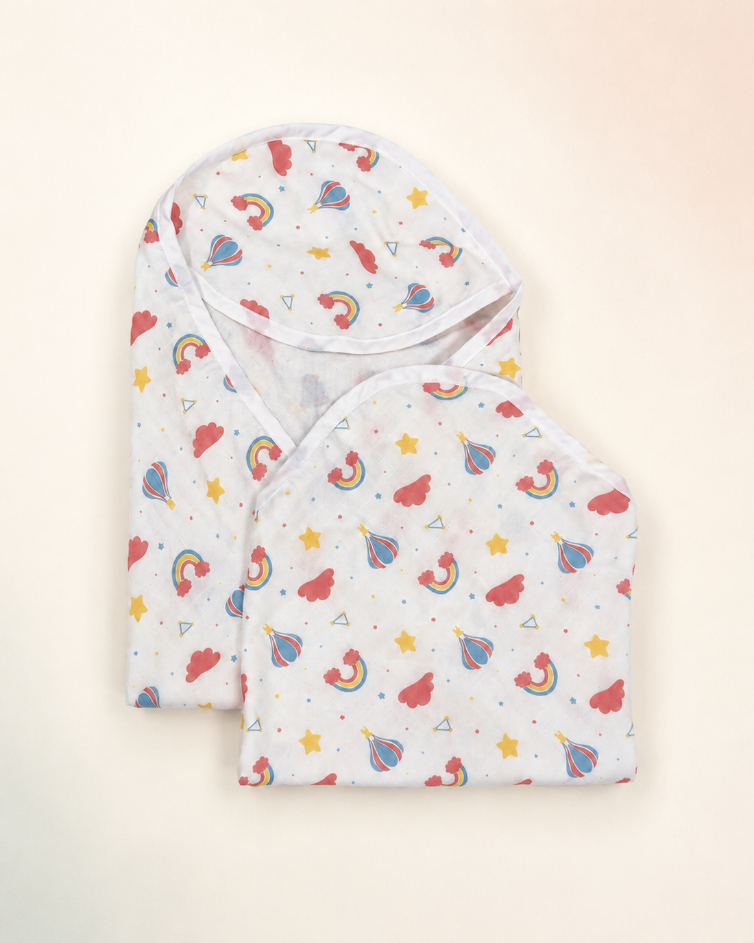 Maison Joey hooded muslin towels pack of two on a seamless warm ivory studio background